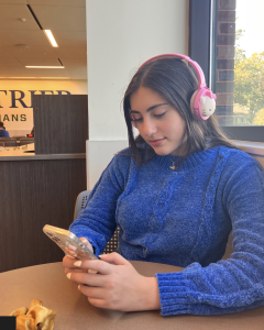 Sophomore Yasmeen Ekhtera listens to music with her Hello Kitty-themed headphones